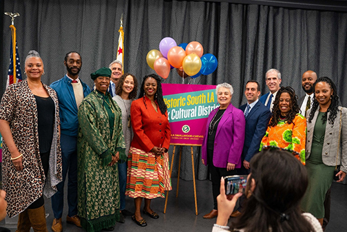 Shown at the Historic South LA Black Cultural District designation press event are (from left) Yvonne Farrow, Co-Director, Vision Theatre Performing Arts Center; Hakeem Parke-Davis, Planning Deputy, LA City Councilwoman Heather Hutt; Aminah Muhammad, President, Leimert Park Merchants Association; Vince Bertoni, Director of Planning, LA City Planning; Cameron Shaw, Executive Director, California African American Museum; Senator Lola Smallwood-Cuevas; Jacqueline Hamilton, Deputy Mayor, LA Mayor Karen Bass; Da